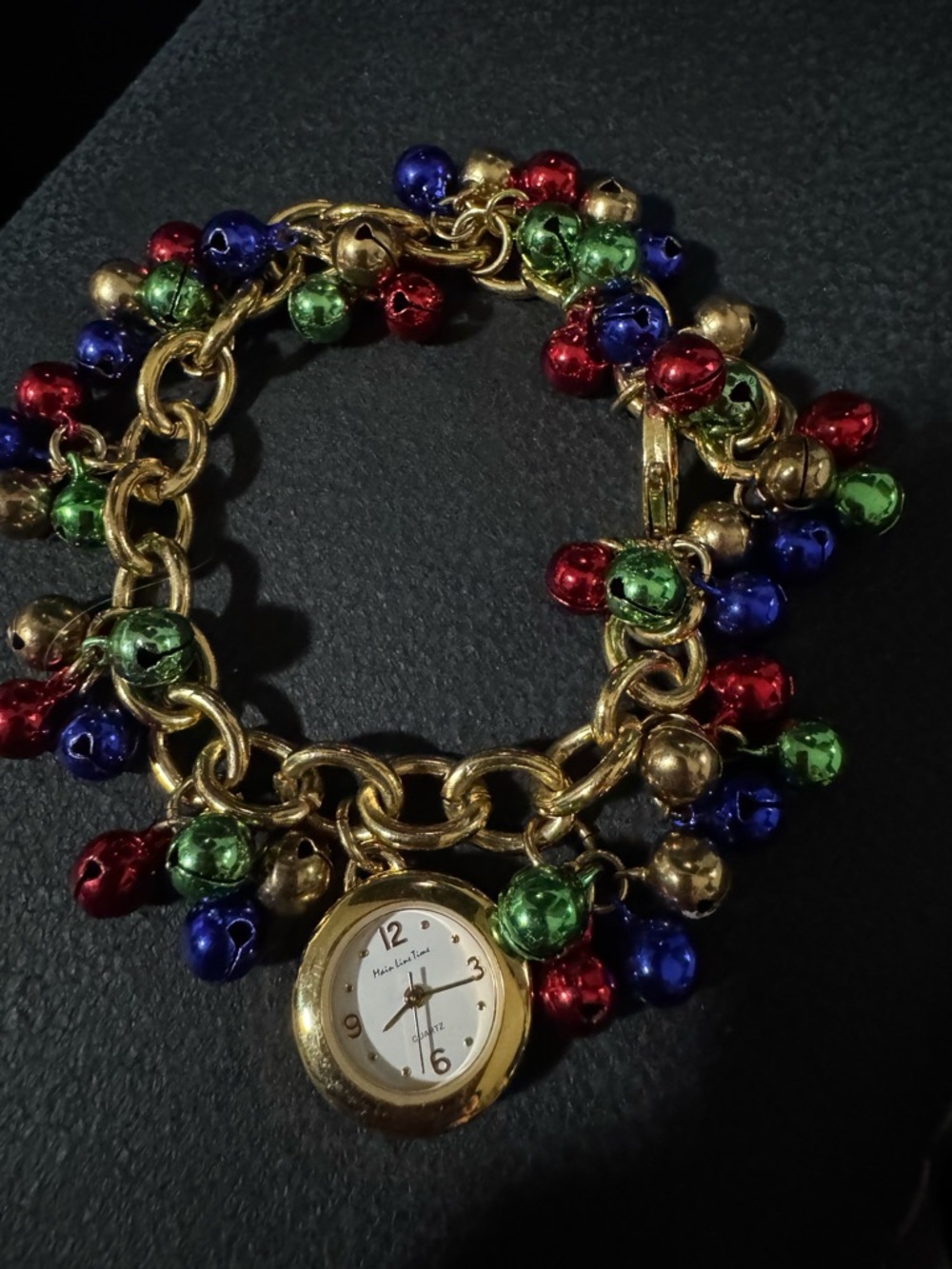 Gold-Tone Charm Bracelet Watch with Red, Green, Blue and Gold Bells